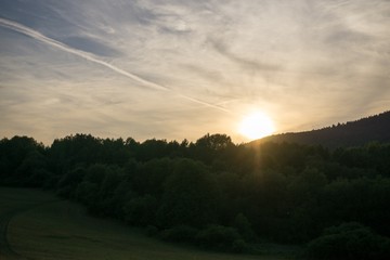 Obraz premium Sunrise and sunset over the hills and town. Slovakia