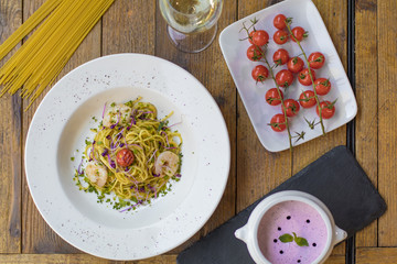 Aglio e olio (spaghetti with oil and garlic) with shrimps and strawberry soup with mascarpone