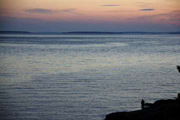 Fototapeta na wymiar Sunset on the ocean in Southwest Harbor Maine
