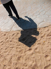 Shadow of the waiter with a tray.