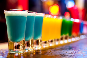 Colorful cocktails on a bar stand