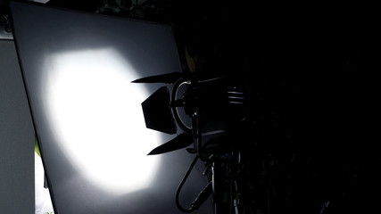 Big studio light and tripod for outdoor movie shooting.