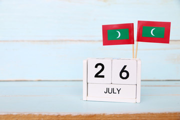 July 26 Wooden calendar Concept independence day of Maldives and Maldives national day.Copy space,minimal style