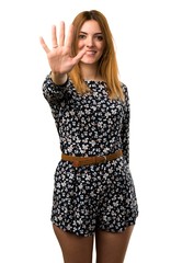 Beautiful young girl counting five