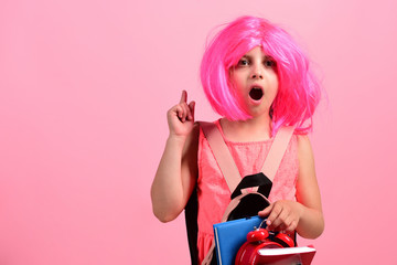 Girl wears backpack: back to school concept