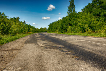 Background texture landscape old road highway with holes in the summer of HDR