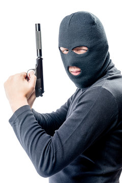 Armed and very dangerous assassin in a balaclava on a white background