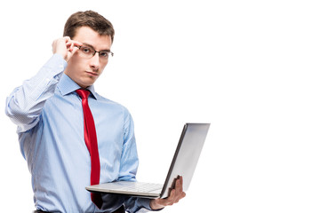 Successful accountant with glasses with a laptop on a white background