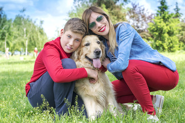 Fototapeta premium Mother, son and dog playing