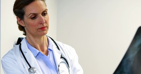 Female doctor examining an x-ray