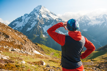 Fototapeta na wymiar Tourist woman hiker on the top of mountain