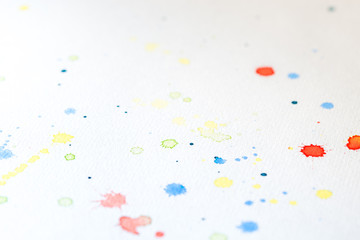Different Colored Spots On White Paper