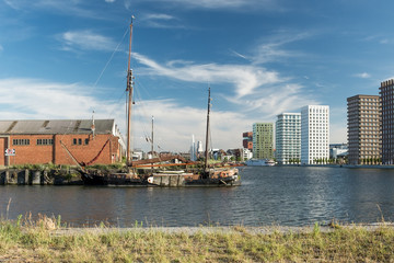Old boat and buildings in Northern part of Antwerp