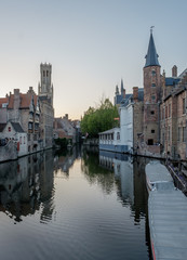 Fototapeta premium Historical building reflected in a canal in Bruges
