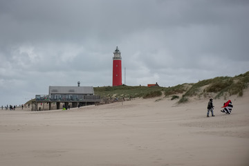 Lighthouse and kite on the sandy beaches of Texel, Sunday 15 May 2016, De Cocksdorp, Texel, the...