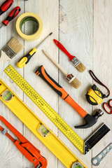 Repairment tools objects isolated on wooden surface
