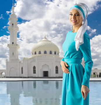 Muslim girl on mosque background