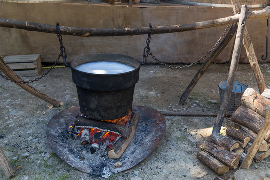 Medieval campfire with iron pot caudron and fire