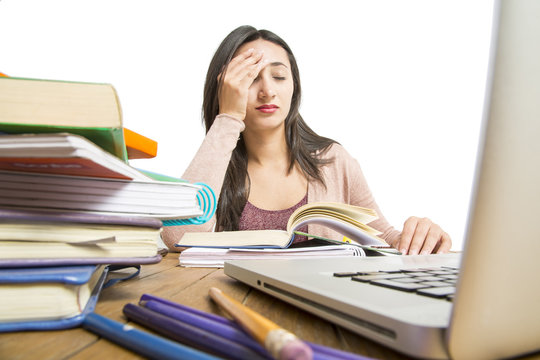 Female student in exams with books