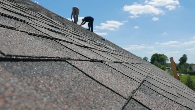 Construction of the roof. Soft roof, shingles. Roofer.