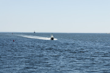 Sport fishing boat approaching port