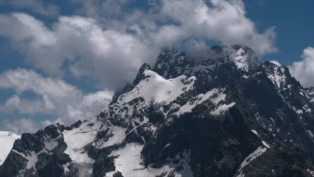 4k Timelapse of Dombay mountains. The territory of the North Caucasus. Republic of Karachay-Cherkessia.Mountains and dance of clouds