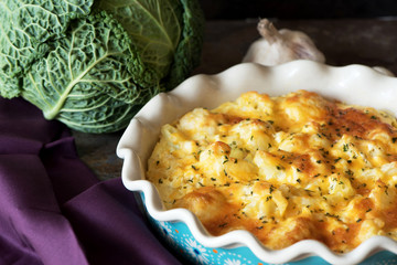 Casserole cabbage is sprinkled with cheese and baked