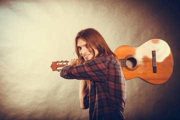 Rock musician destroys his guitar.