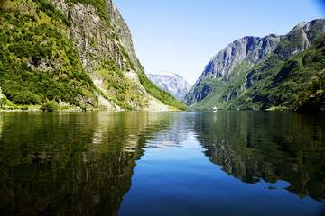 Fototapeta na wymiar Green mountains and Waterfalls in Sognefjord Scandinavia. Norway