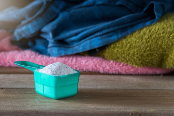 Detergent or washing powder in measuring spoon