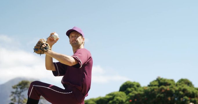 Baseball players pitching ball during practice session