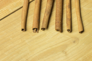 Cinnamon stick on wooden table. copy space. macro