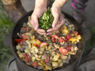 Adding Herbs To Dish