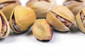 Pistachio nuts on a white background.