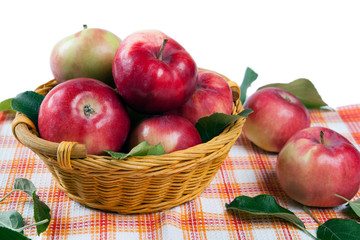 Fototapeta na wymiar Still life of many apples on a napkin in the basket