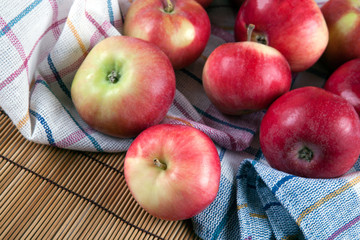 Still life of many apples on a napkin