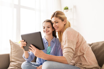 happy family with tablet pc at home