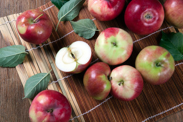Still life of many apples on a bamboo napkin
