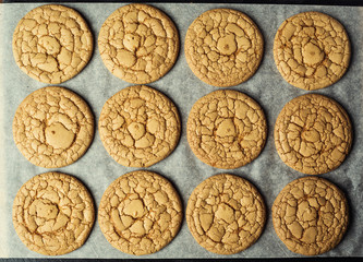 Biscuit sweet cookie background. Domestic stacked butter biscuit pattern concept,close up macro.Homemade cookies on wooden table.Cereal biscuits with the sesame,peanuts,sunflower and amaranth.