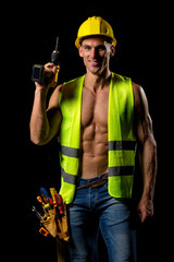 fit shirtless worker with drill and tools