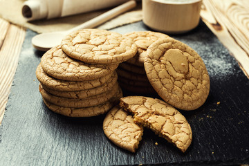 Biscuit sweet cookie background. Domestic stacked butter biscuit pattern concept,close up macro.Homemade cookies on wooden table.Cereal biscuits with the sesame,peanuts,sunflower and amaranth.