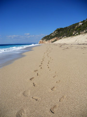 Footprints in the sand - Milos beach, Lefkada island, Greece