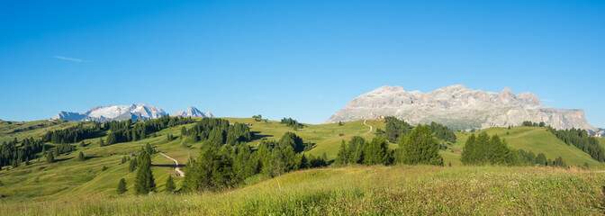 Fototapeta na wymiar Great landscape on the Dolomites. View on Sella group and Marmolada. Alta Badia, Sud Tirol, Italy