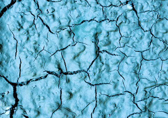 Background texture relief relief structural cracked dry clay soil close-up