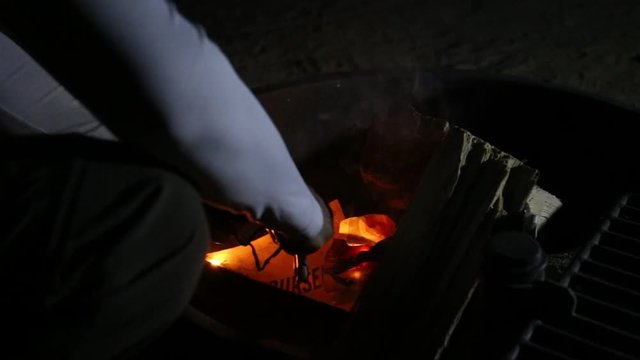 Starting a Campfire with a Flint Striker and Fire Burning