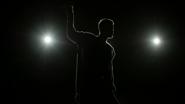 Silhouette of dance performing man