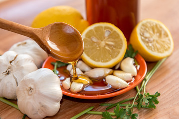 Organic vegetables antioxidant diet with garlic lemon honey and leaves of parsley 