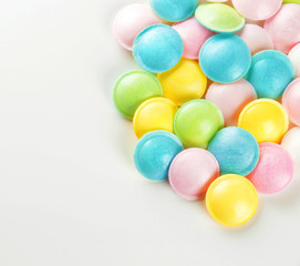 Tasty colorful candies on white background