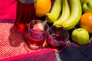 picnic on the grass. juice,fruit,Picnic at the park on the grass,healthy food and...