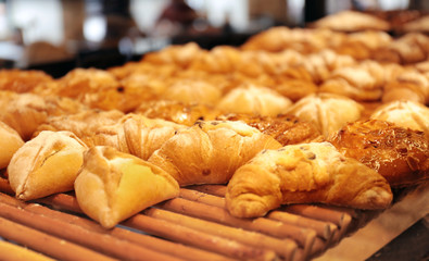 Counter with bakery products in shop, closeup